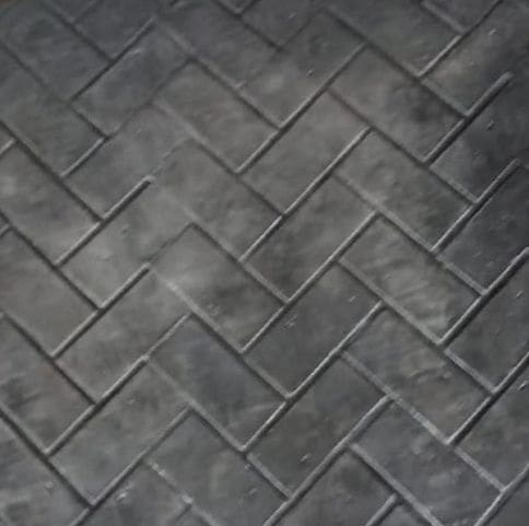 Stamped concrete pathway with natural stone pattern