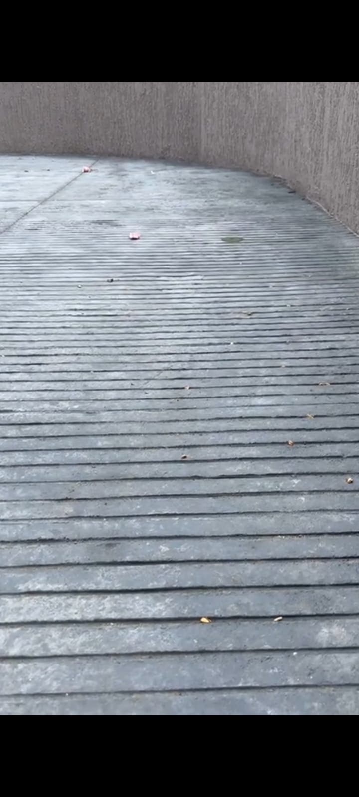 Red stamped concrete with brick pattern