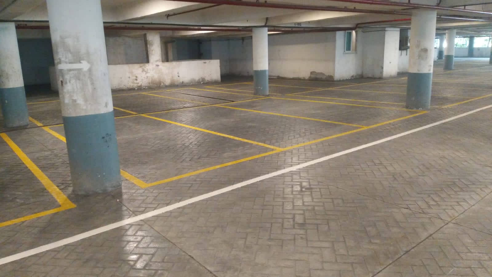 Indoor parking with freshly painted yellow lines