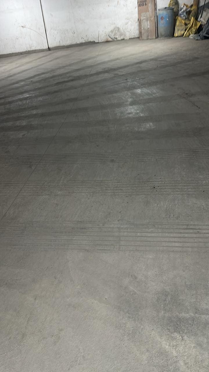 Concrete floor with drainage grooves in warehouse