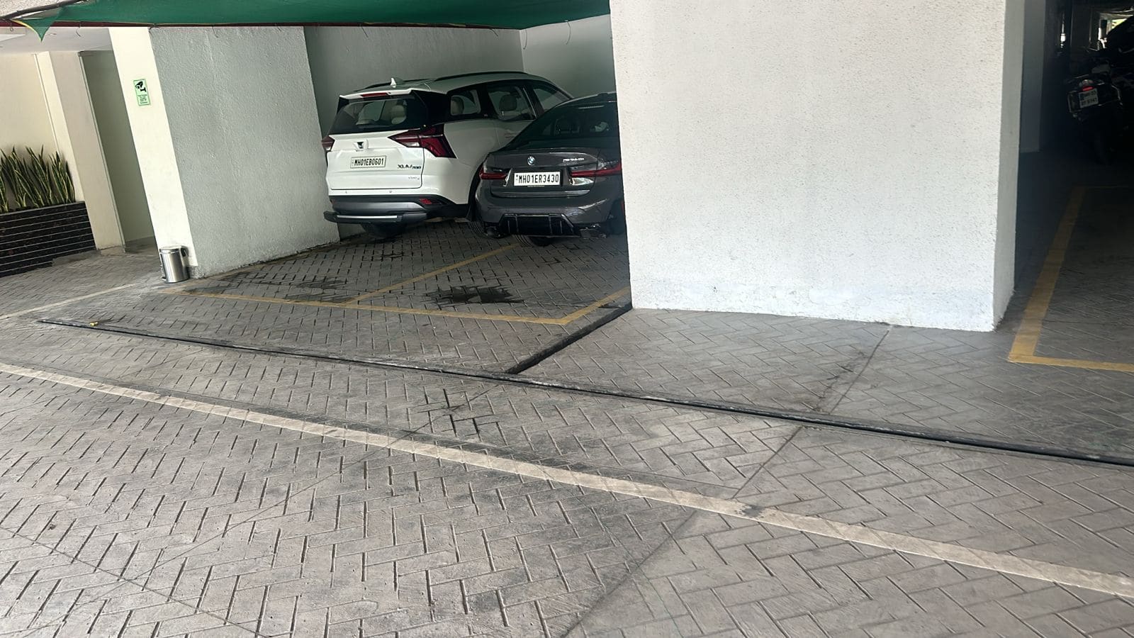 Stamped concrete parking with drainage channel